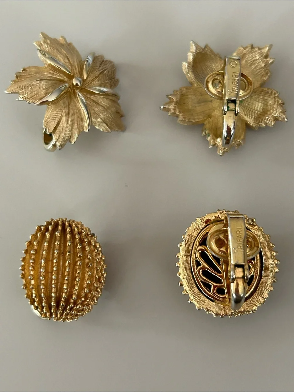 2 pairs of #CrownTrifari Clip-on Earrings. Gold-Tone Ribbed Domes and Florals.